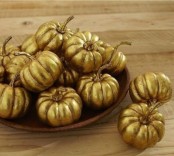 refined gilded pumpkins in a bowl will make your Thanksgiving tablescape chic, refined and will be an easy centerpiece