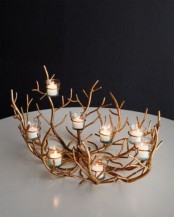 a gold botanical candlelabra with multiple candles is a chic idea for Thanksgiving decor