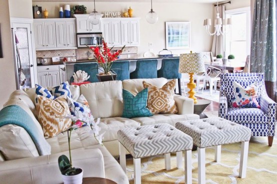 a welcoming bright living room with a couple of IKEa Lack tables turned into lovely poufs with tufting is a gorgeous solution to try