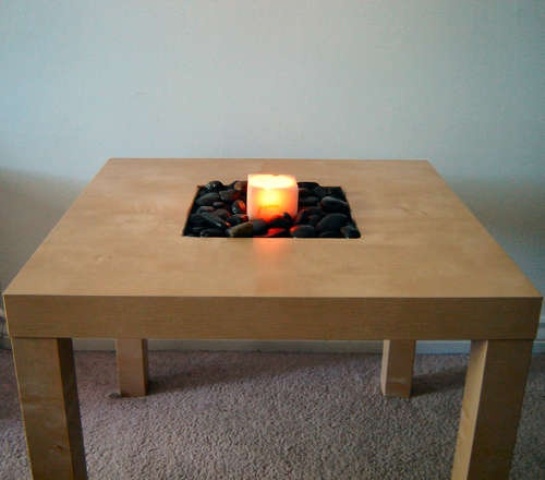 a tan IKEA Lack table with a bit of pebbles and a candle in the center will be a nice relaxing addition to any bathroom or other spa-inspired space