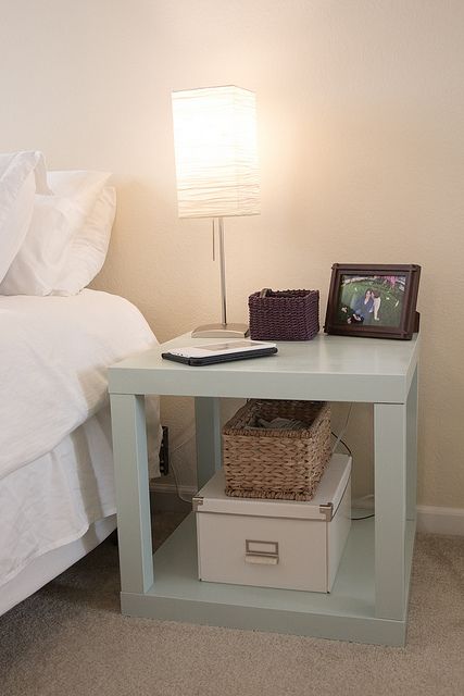 two IKEA Lack tables turned into one nightstand and painted aqua that is a cool and chic idea for a neutral bedroom, to add a delicate touch of color