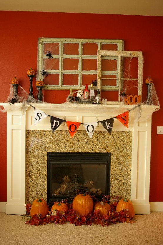 Two antique window frames gets a holiday makeover thanks to a creepy spider webs and spider silhouette cutouts. 