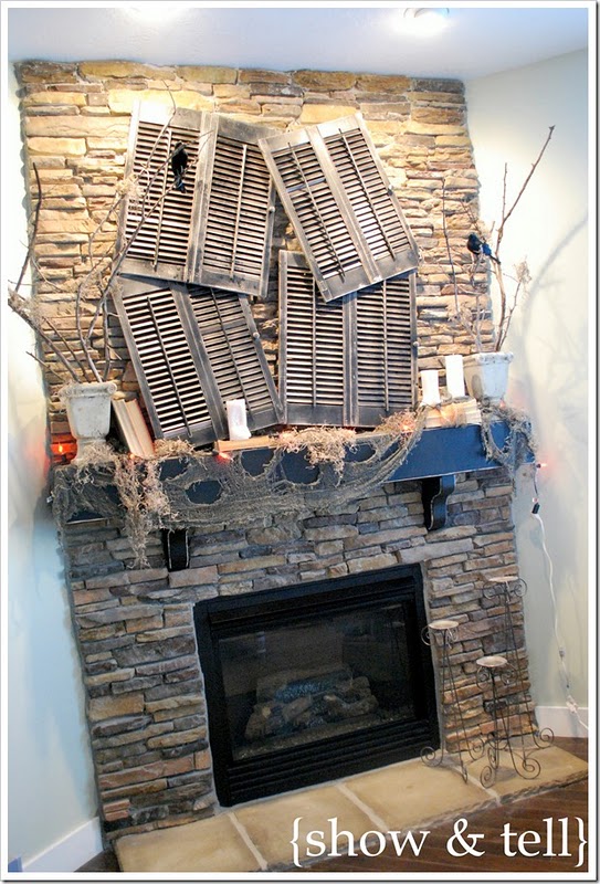 Halloween Mantel Decorating Ideas Hang a bunch of weathered window shutters and add several planters with tree branches. Put some raven figures on these branches and your rustic Halloween fireplace mantel scene is ready!