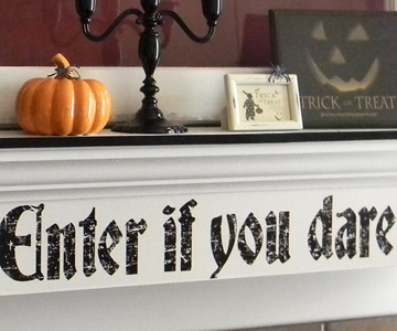 Halloween Mantel Decorating Ideas A spooky decal from your local crafts store and apply to a smoothly painted surface. It'd be easy to peel off later.