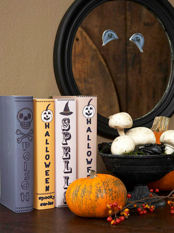 Halloween Mantel Decorating Ideas Wrap some of your books with heavy-duty brochure paper. Attach your own text and Halloween embellishments on them.