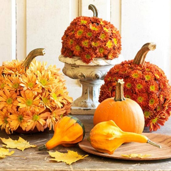 gourds and pumpkins covered with bold fall blooms are lovely for fall or Thanksgiving decor