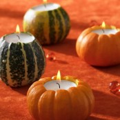 gourds and pumpkins carved to hold candles are cool for natural and cozy Thanksgiving decor or just for fall