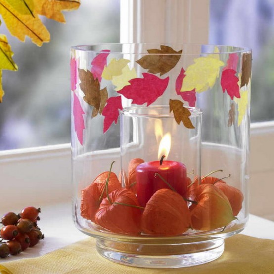 a glass with dried blooms and colorful leaves plus one more glass with a candle is a lovely decoration to rock