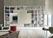 an oversized storage unit with a TV integrated inside and sleek white panels hiding this TV is a cool modern or contemporary idea