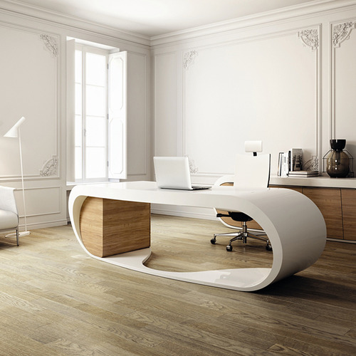 a neutral sophisticated home office with white walls and molding, with a sleek storage unit, a beautiful curved white desk and a lovely chair