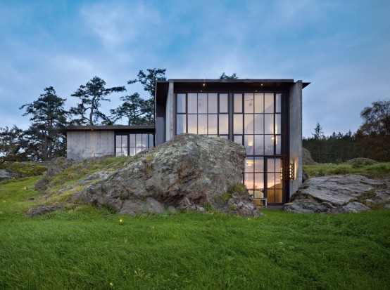 Pierre House With A Contrasting Interior Nestled Into The Rocks