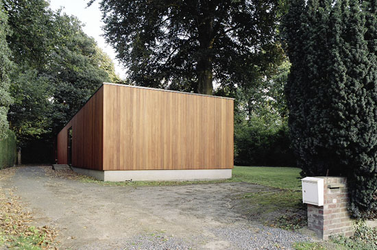 House With Large Glazing And Very Old Pine Tree On Site