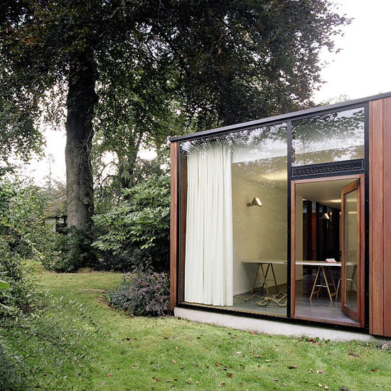 House With Large Glazing And Very Old Pine Tree On Site