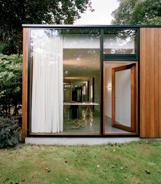 House With Large Glazing And Very Old Pine Tree On Site