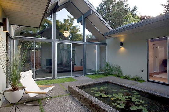 House Wraped Around The Open Atrium With High Double Gables