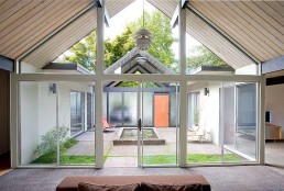 House Wraped Around The Open Atrium With High Double Gables