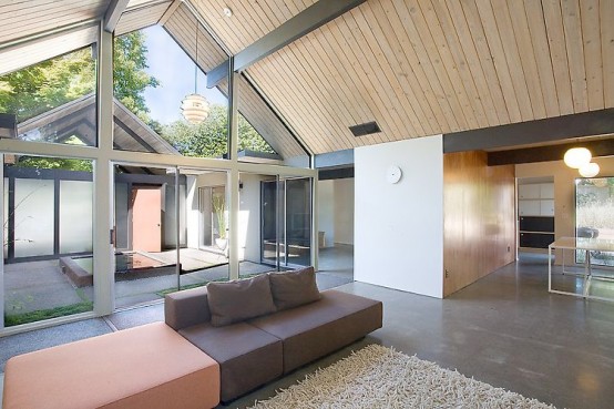 House Wraped Around The Open Atrium With High Double Gables