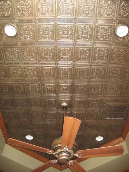 a brass tin tile ceiling with built in lights and a fan looks sophisticated, eye catchy and very chic