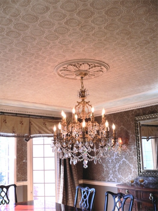 a beautiful copper wallpaper ceiling with a medallion and a large heavy chandelier is a cool and exquisite solution for any room