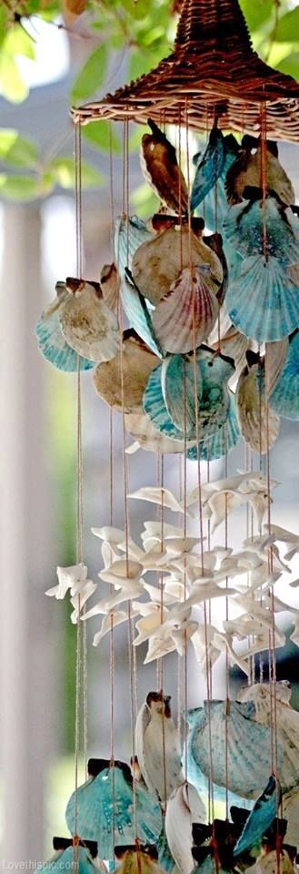 a catchy chandelier with blue and white seashells, starfish and a wicker base is a cool idea for a beach or boho space or for outdoors