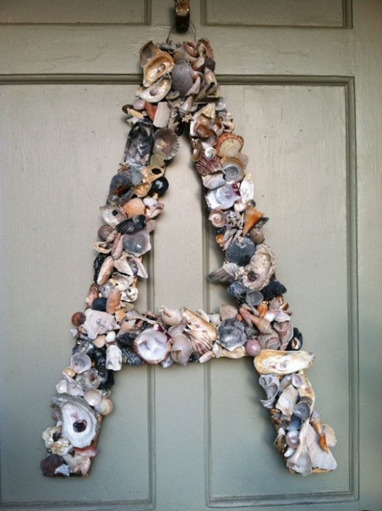 accent your front door with a large monogram made of seashells - a perfect idea for a coastal home or for summer