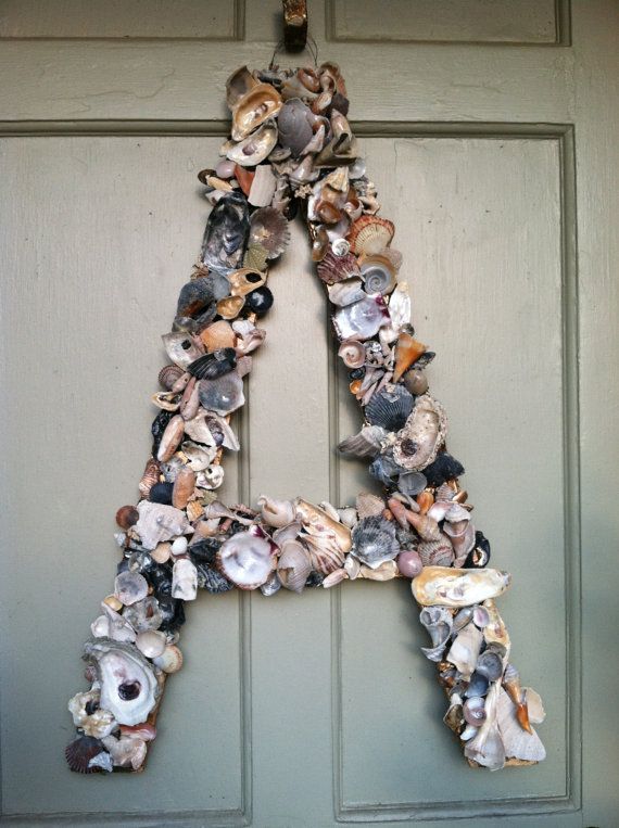 accent your front door with a large monogram made of seashells   a perfect idea for a coastal home or for summer