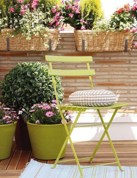 lots of baskets and planters with summer blooms will turn any of your outdoor spaces into a summer paradise