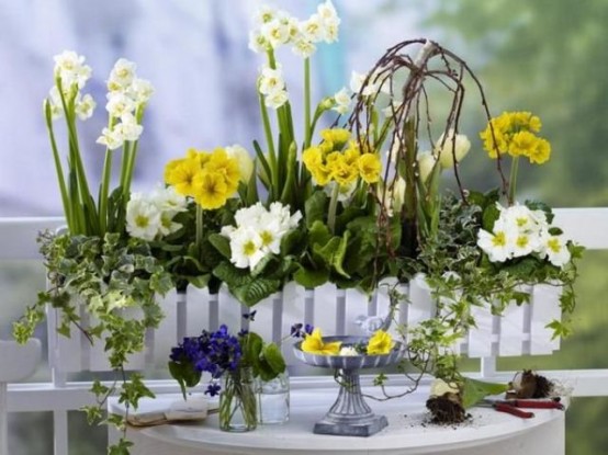 a white fence planter with neutral and yellow blooms will brign a bright summer touch to any of your spaces