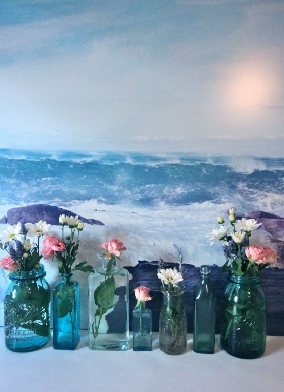 blue jars and bottles with pink, white and purple blooms will make your space very relaxed and summer-infused