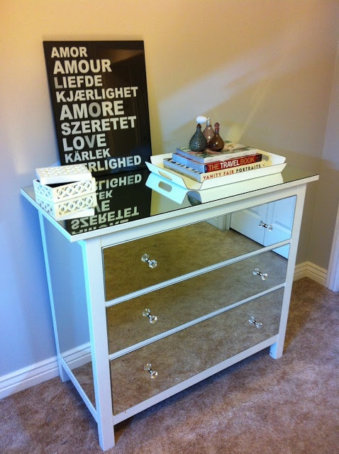 an IKEA Malm hack with mirror panelling, a mirror countertop and glass knobs