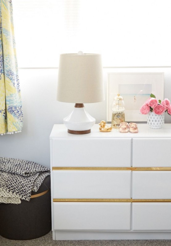 black dresser with gold trim