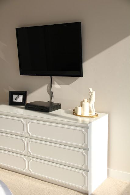 black dresser with gold trim