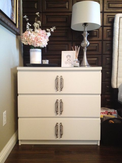 a white IKEA Malm dresser hacked with catchy geometric handles in the center