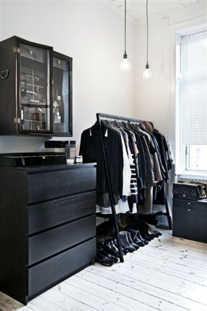 a Scandinavian closet done with a black Malm dresser for smaller items