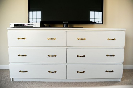a simple IKEA Malm dresser hack with vintage brass handles as a TV stand