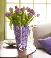 purple tulips in a vase covered with a purple paper cover is a bold vintage-inspired spring decoration