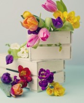 white pallet boxes with colorful tulips is a cool spring decoration to rock for spring and Easter