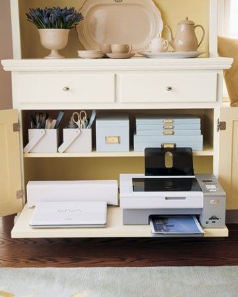 a neutral credenza with drawers to hide all the office supplies and other items that you need for work