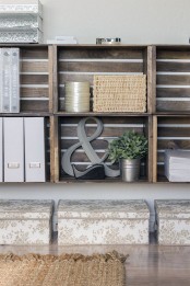 crate shelves taking the whole wall give much storage space and add a touch of rustic decor to the home office