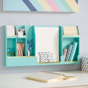 a colorful wall-mounted storage unit with open departments is an ultimate choice for a modern home office