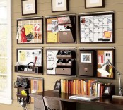 wall-mounted storage units with various holders, shelves and other storage items is perfect for a small office