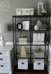 a simple black open shelving unit is a comfortable storage piece to hold and store everything you want and make your space more organized