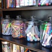 large glass jars for storing crayons, pens, pencils, markers and other office stuff