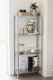 an IKEA Hyllis shelf is placed into an awkward nook for storage is great to use every inch of space