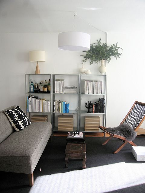 IKEA Hyllis shelves with books, boxes and a mini bar plus vases and lamps