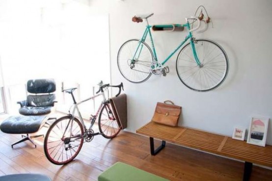 a plywood bike holder like this one can be attached to the wall in many ways to securely store your bike anywhere