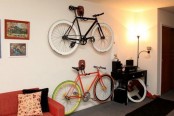 shelf and hook holders attached to the wall can hold bikes easily and make them part of your home decor
