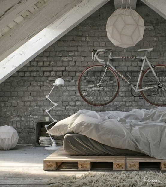 a holder for the bike attached to the wall over the bed gives the space a bold dynamic feel and matches the industrial interior