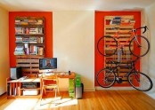 a pallet shelf holding books, shelves and bikes is a lovely idea for any space and you can DIY this piece