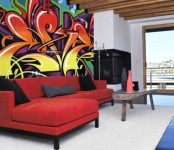 a neutral contemporary living room with a built-in corner fireplace and a super bold graffiti over the sofa for accenting the space and making it bolder